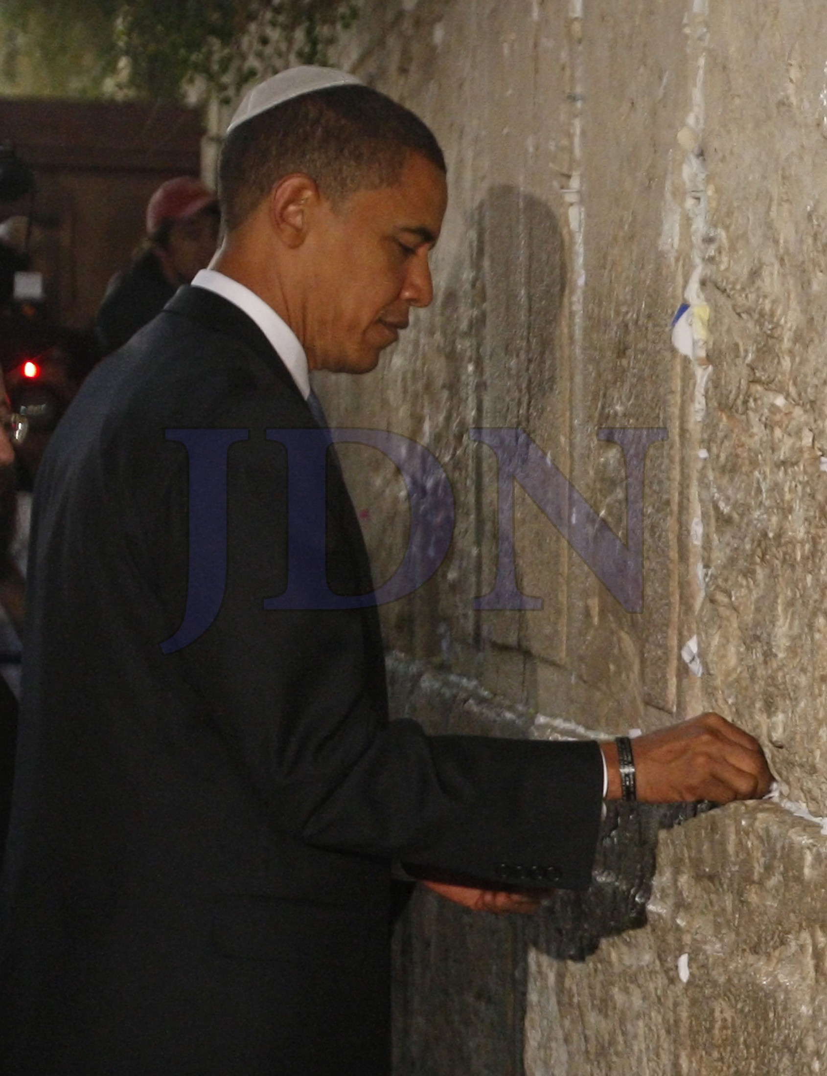 US Democratic presidential candidate Senator Barack Obama places a prayer in the Western Wall in Jerusalem