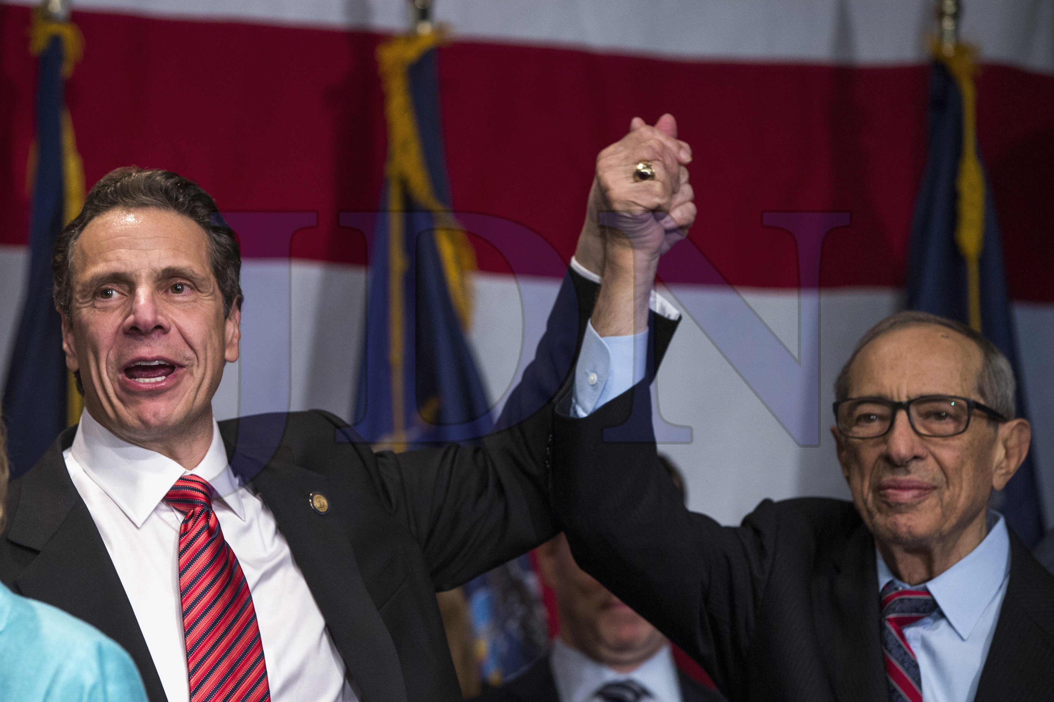 Democratic New York Governor Cuomo reacts with his father Mario after winning the New York gubernatorial race during the U.S. midterm elections at an event in New York