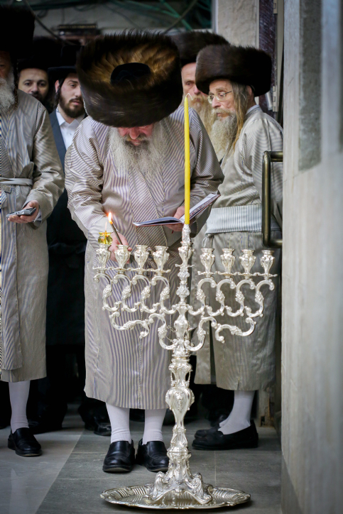 Ultra orthodox jews of the Lelov Hassidic dynasty in the city of Beit Shemesh light a large chanuckia, on the first night of the Jewish holiday of Hanukkah. Hanukkah, also known as the Festival of Lights, is an eight-day Jewish holiday commemorating the rededication of the Holy Temple. The festival is observed by the kindling of the lights of a 'hanuckia'- a nine-branched candelabrum, with one additional light being lit on each night of the holiday. December 24, 2016. Photo by yaakov Lederman/Flash90 *** Local Caption *** ????? ??????? ???? ?????? ??????? ? ?????