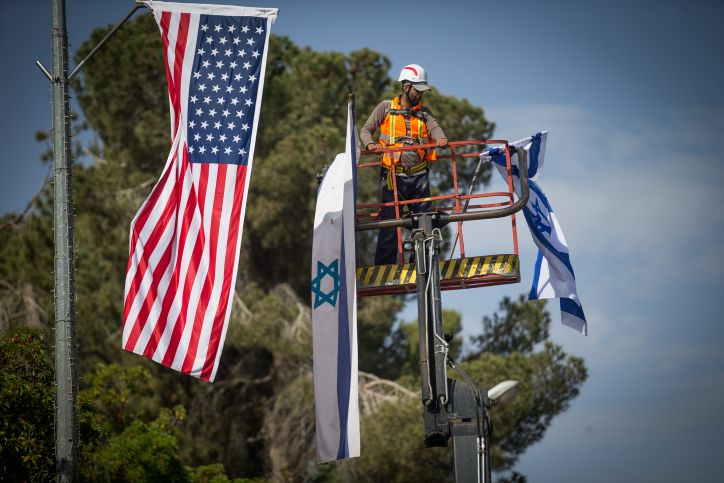 Jerusalem municipality worker hangs an American and Israeli flags near the President's House in Jerusalem on May 18, 2017, in preparation for the upcoming visit of US President Donald Trump. Photo by Yonatan Sindel/Flash90 *** Local Caption *** ??? ????? ????? ???? ???"? ???? ???? ????? ?????