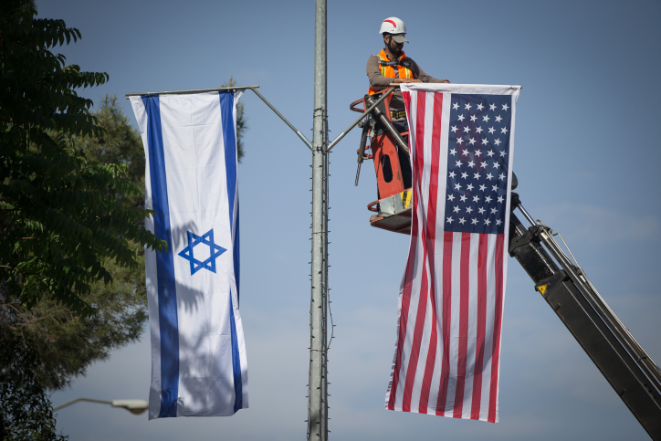 Jerusalem municipality worker hangs an American and Israeli flags near the President's House in Jerusalem on May 18, 2017, in preparation for the upcoming visit of US President Donald Trump. Photo by Yonatan Sindel/Flash90 *** Local Caption *** ??? ????? ????? ???? ???"? ???? ???? ????? ?????