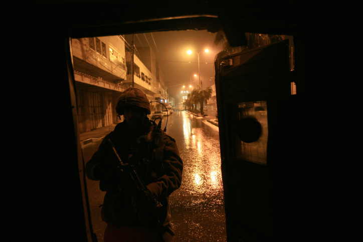 IDF soldiers are breaking into Hamas institutions and confiscating computers and documents, late night in the city of Hebron on the West Bank