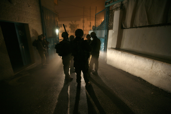 IDF soldiers are breaking into Hamas institutions and confiscating computers and documents, late night in the city of Hebron on the West Bank