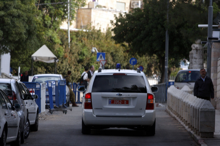 Investigators from the National Fraud Investigation Unit, arrive to the house of Israel's Prime Minister Ehud Olmert