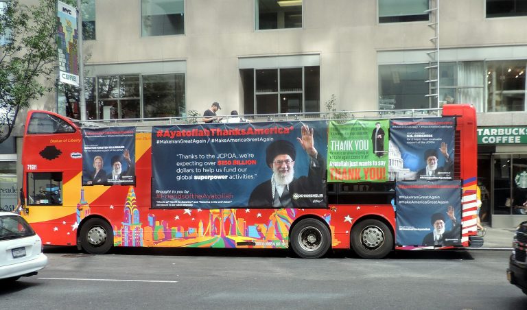 Tour_bus_on_W58_with_JCPOA_ad_jeh