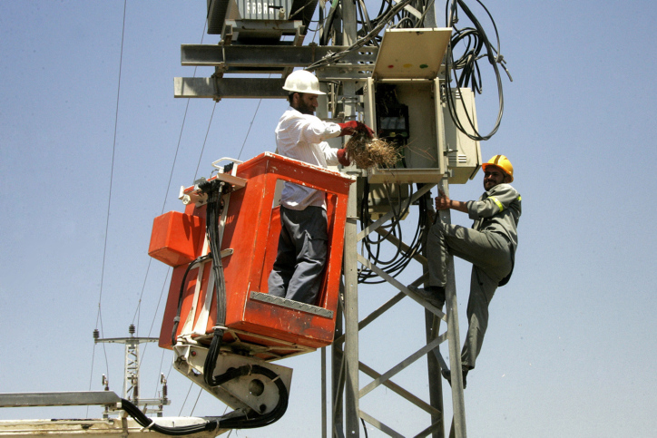 Palestinian workers trying to repair the electricity in Rafah in southern Gaza Strip