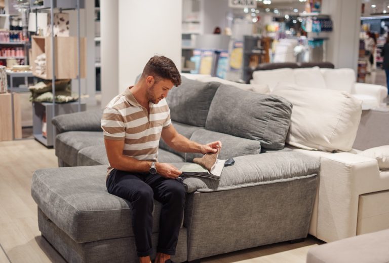 man-choosing-sofa-upholstery-color