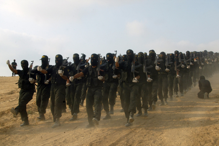 Islamic Jihad militants show their skills and detonated explosives and opened fire with heavy machine guns on The site is the fictional American flag during a training session in west of Khan Younis in southern Gaza Strip