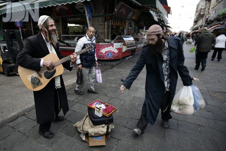 religious man singing in the market