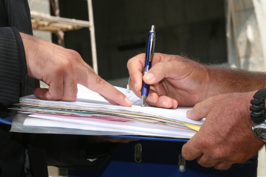 Illustration of a man signing a contract