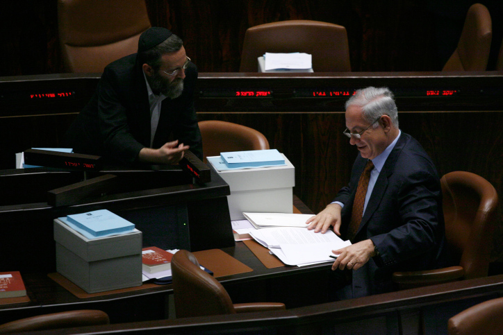 Prime minister Benjamin Netanyahu speaks to Moshe Gafni