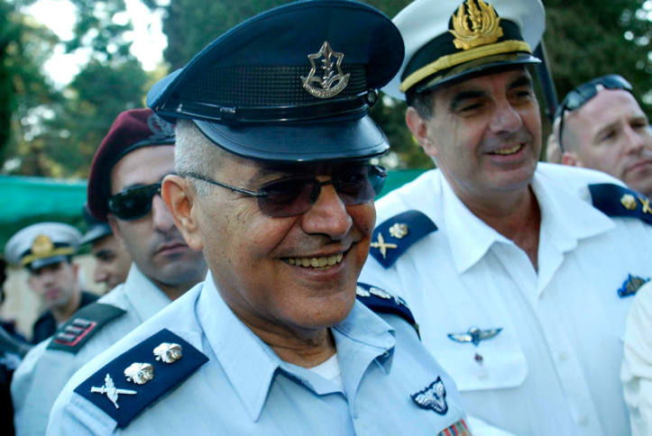 Israel's Chief of Staff Lt. Gen. Dan Halutz salutes as he stands next to Defense Minister Amir Peretz, right, during a memorial for sailors who died in the Dakar Submarine that went missing in 1968, at Mount Herzl Cemetery in Jerusalem, Thursday, Jan