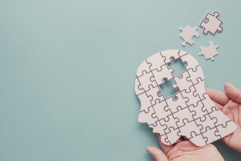 hands-holding-brain-with-puzzle-paper-cutout-world-mental-health-day