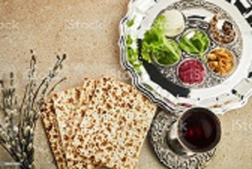 Passover Seder plate with traditional food ontravertine stone background