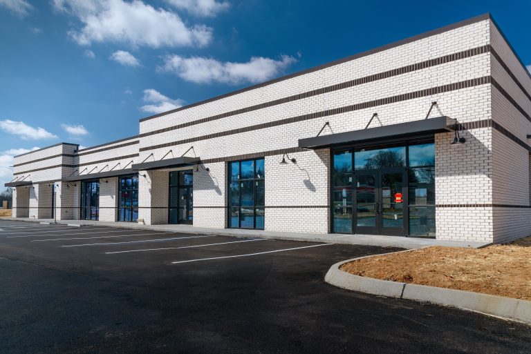 Horizontal,Shot,Of,New,Retail,Strip,Shopping,Center,With,Under