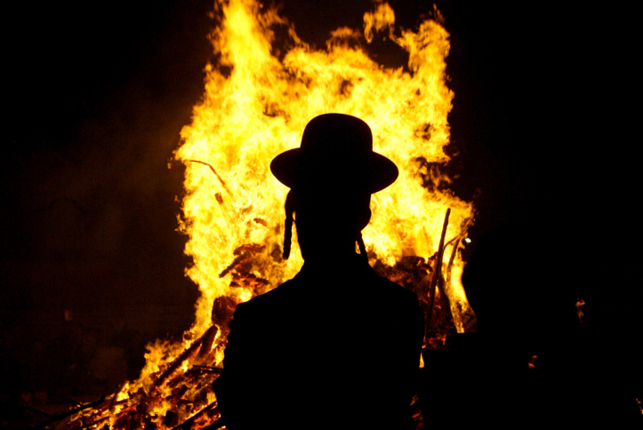 The Jewish holiday of Lag Baomer by a bonfire in Jerusalem
