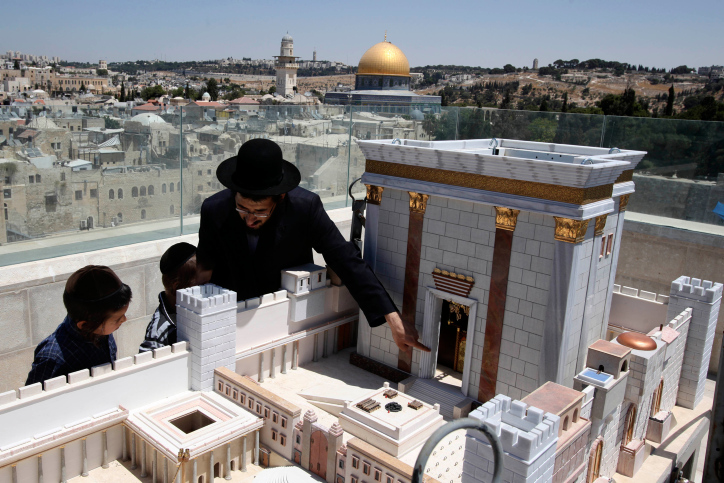 ultra orthodox Jews look at model of the ancient Second Temple