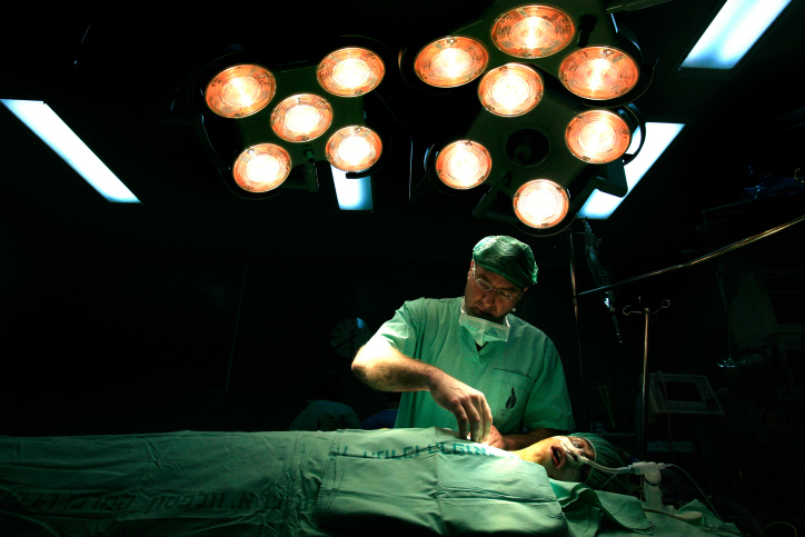 Surgeon Lior Sasson, head of patient care in the cardiology unit at Wolfson Hospital, conducts open heart surgery on Sakar, at Wolfson Hospital in Holon