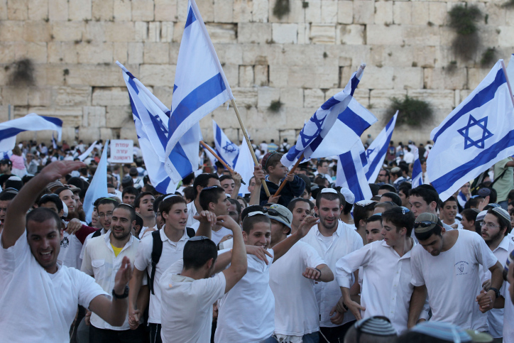 Israelis taking part in the annual flags parade as they celebrating Jerusalem Day in the streets of Jerusalem