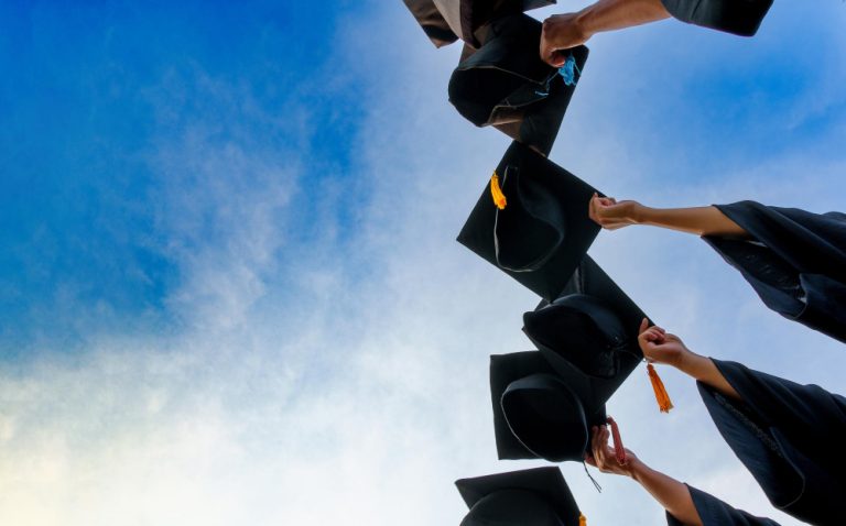 graduation-caps-thrown-air-success-graduates-universityconcept-education-congratulation-graduates-university