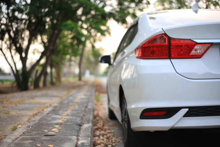 White,Car,On,Parking,close,Up,Side,Of,White,Car,On