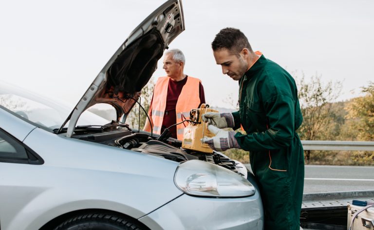 Two,Road,Assistant,Workers,In,Towing,Service,Trying,To,Start