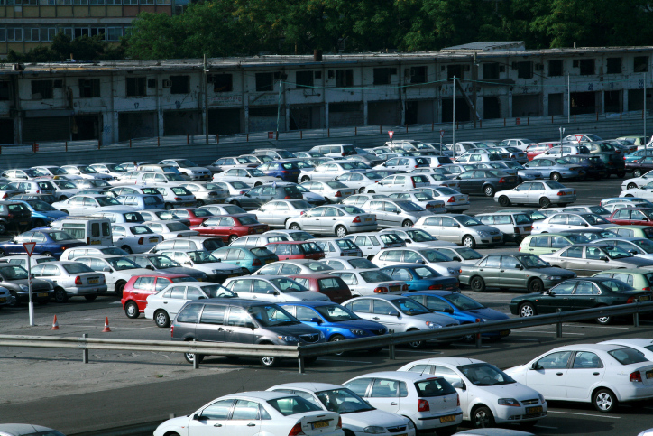 Cars fill a parking lot  in Tel Aviv
