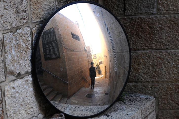 An illustration of an ultra orthodox jewish man walking in the old city of Jerusalem