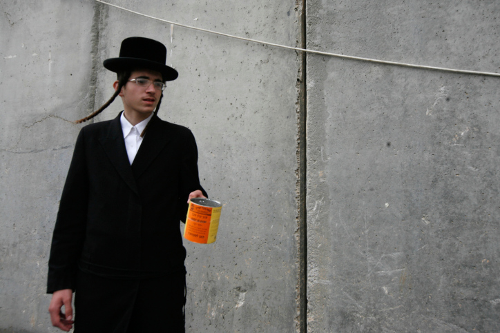 ultra orthodox Jewish by separation wall