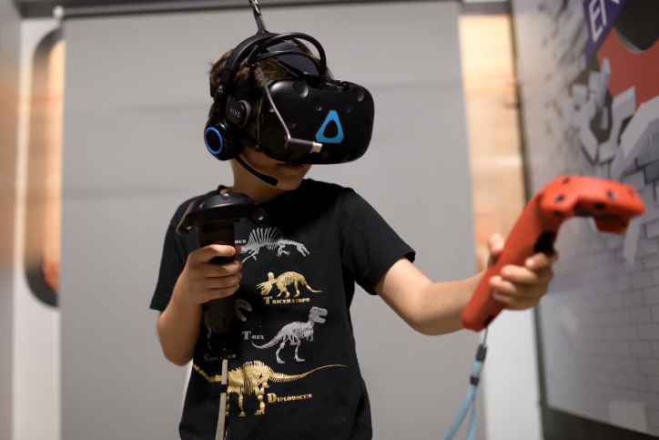 A kid plays in a VR Games arcade