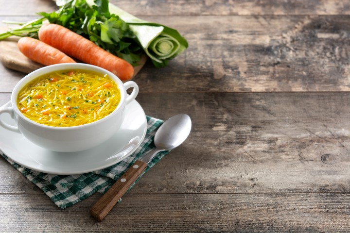 Chicken noodle soup in white bowl
