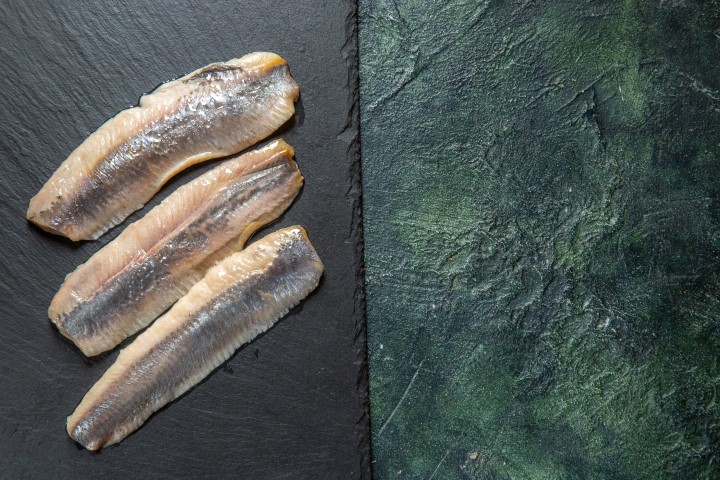 top-view-fresh-raw-chopped-fish-black-wooden-cutting-board-right-side-mix-colors-background (Small)