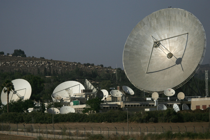 satellite dishes in a field