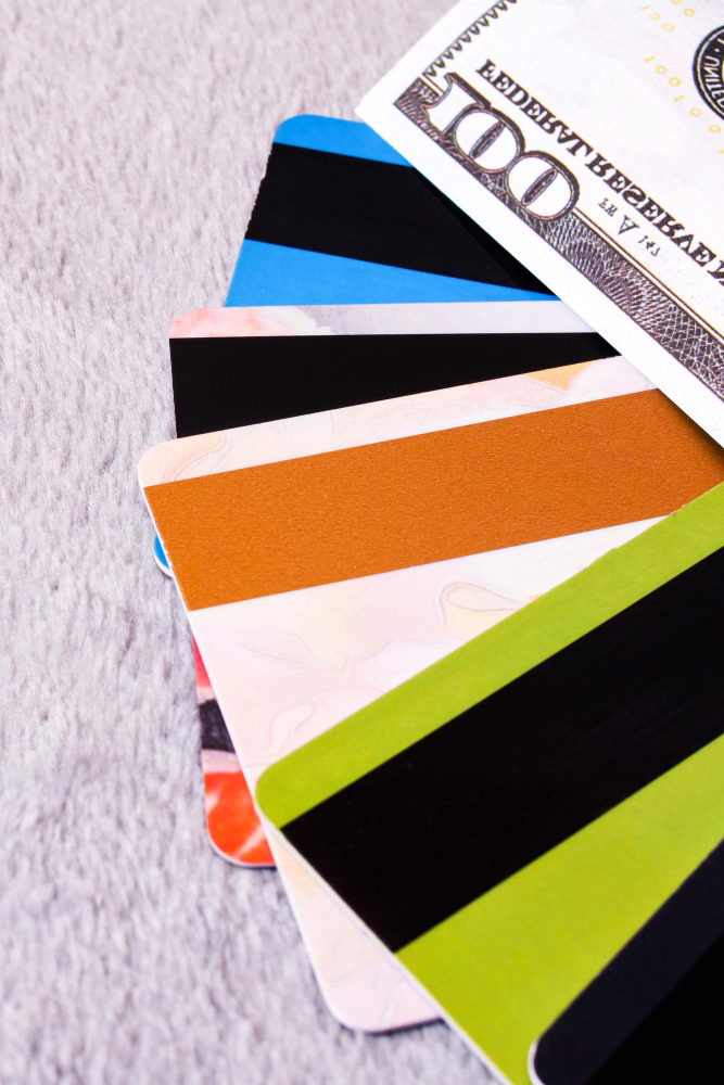 dollar-bill-bank-cards-gray-background
