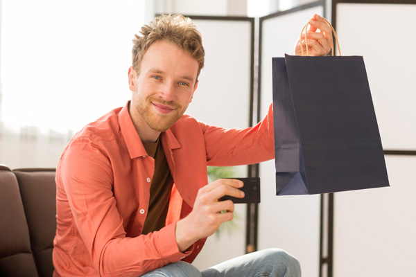 man-holding-bag-credit-card