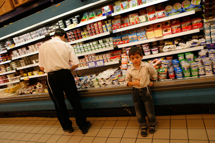 Israelis shop in a supermarket in the Jewish settlement of Betar Aylit the upcoming Rosh Hashana feast