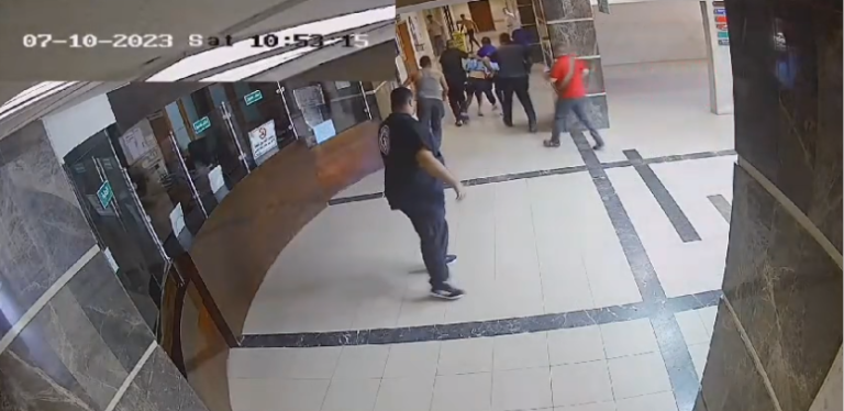 Hostage_being_dragged_through_foyer_of_Al_Shifa_Hospital_by_Hamas_gunmen