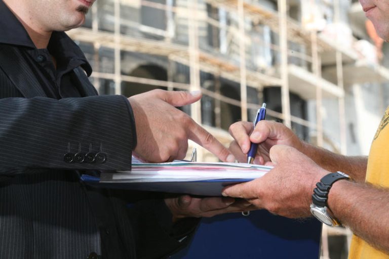 Illustration of a man signing a contract