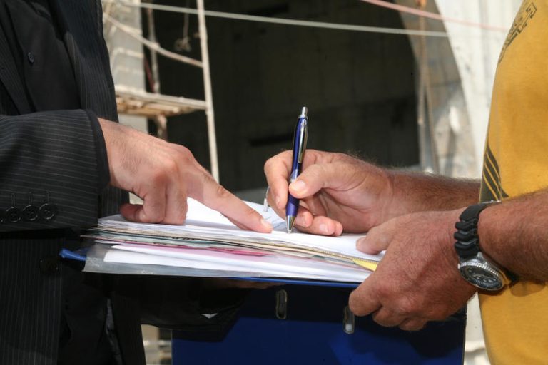 Illustration of a man signing a contract
