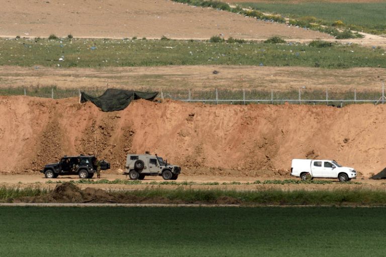 Israeli soldiers patrol near the Israel Gazan border