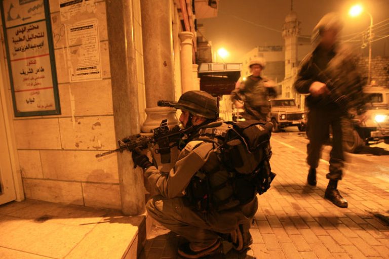 IDF soldiers are breaking into Hamas institutions and confiscating computers and documents, late night in the city of Hebron on the West Bank