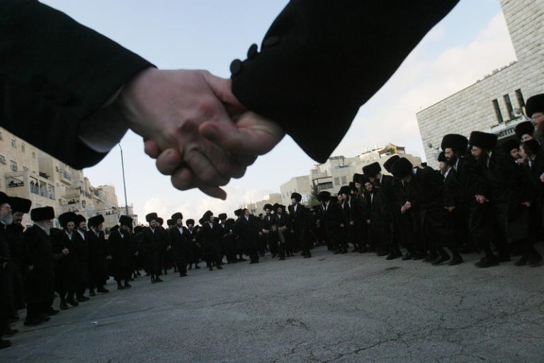 Ultra-Orthodox Jewish men dance as they celebrate the wedding of Aharon Noah Alter, the grandson of the chief rabbi of the Gur ultra-Orthodox sect, held in Jerusalem