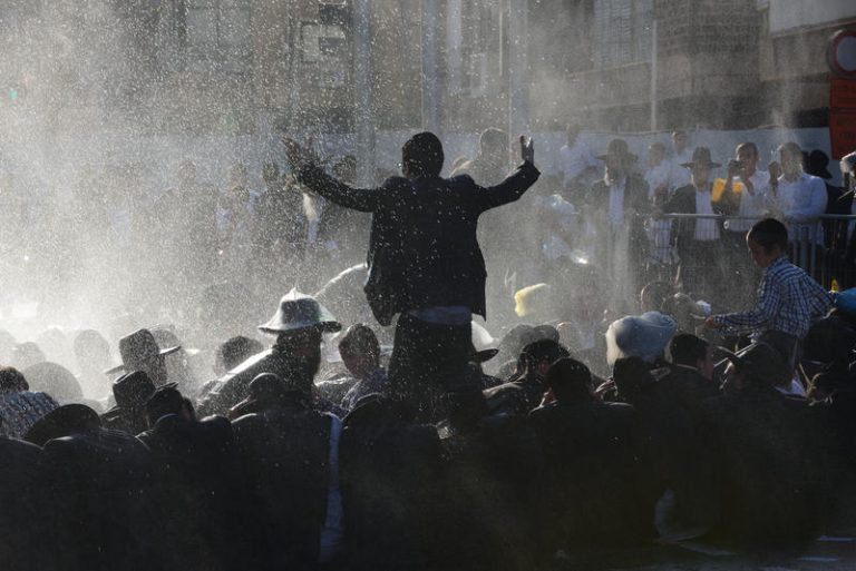 Ultra orthodox Jews clash with police as they protest against the arrest of ultra orthodox men who failed to show for their army draft in Bnei-Brak