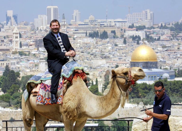 Mayor of Jerusalem Uri Lupolianski on the Mount of Olives riding a camel