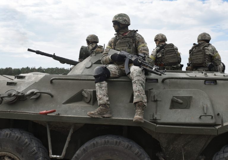 Soldiers,With,Machine,Guns,On,An,Armored,Personnel,Carrier