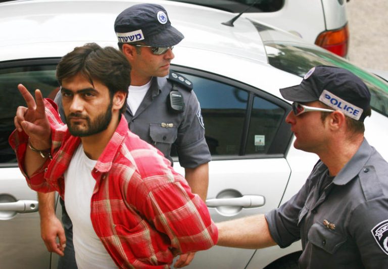 Palestinian Basel al-Asma is restrained by Israeli police