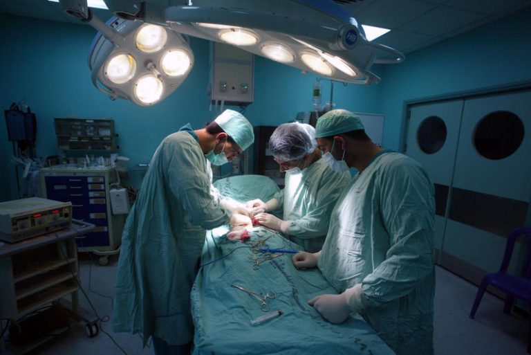 Doctors at a hospital in Rafah perform surgery on a 10-year old girl